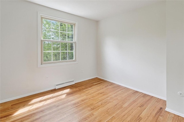 179 Kelvington Dr, Monroeville, PA 15146 - unfurnished room with baseboard heating, light wood finished floors, and baseboards