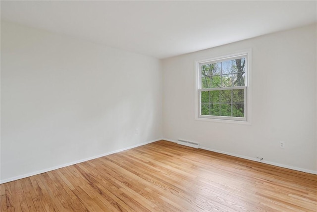 179 Kelvington Dr, Monroeville, PA 15146 - unfurnished room with light wood finished floors, baseboards, and baseboard heating