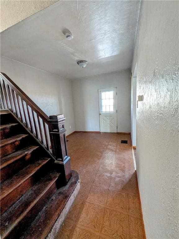 330 Quincy Ave, Mount Oliver, PA 15210 - foyer entrance with stairway and a textured wall