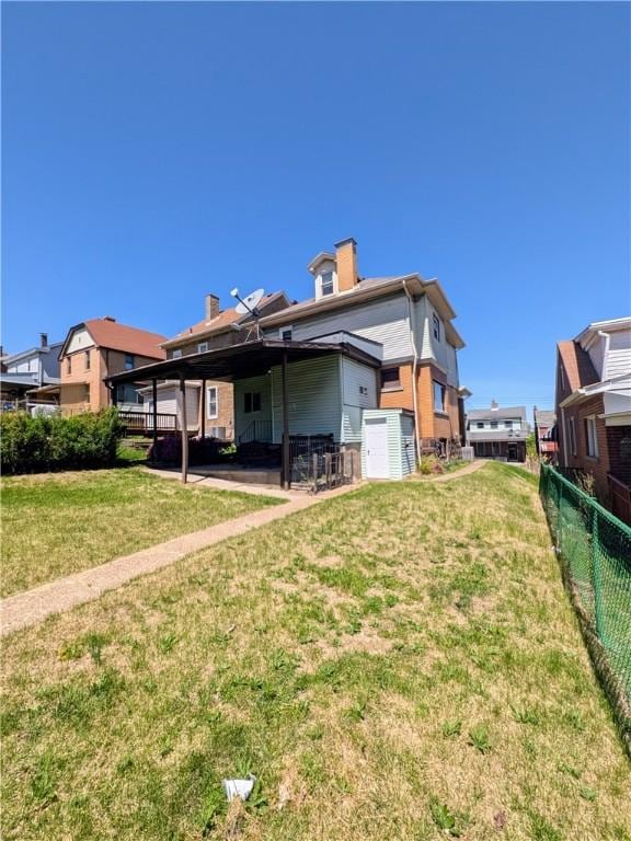 330 Quincy Ave, Mount Oliver, PA 15210 - rear view of house with a patio area and a chimney