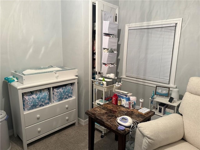 carpeted office space with baseboards