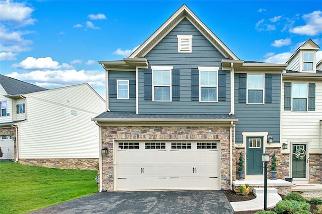 7005 Augusta Ln, Penn Twp Wml, PA 15644 - view of front of home featuring driveway, stone siding, an attached garage, and a front lawn