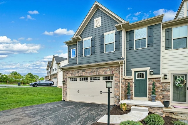 7005 Augusta Ln, Penn Twp Wml, PA 15644 - townhome / multi-family property featuring asphalt driveway, an attached garage, a front lawn, and stone siding