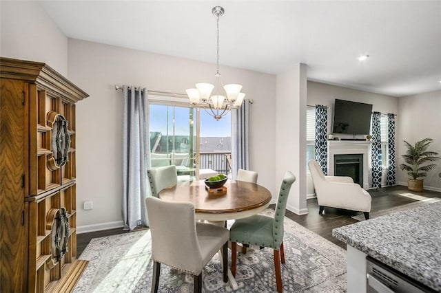 7005 Augusta Ln, Penn Twp Wml, PA 15644 - dining space with a chandelier, baseboards, wood finished floors, a fireplace, and recessed lighting