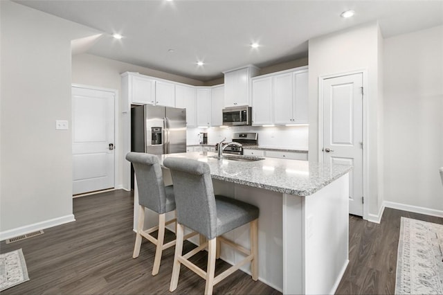7005 Augusta Ln, Penn Twp Wml, PA 15644 - kitchen featuring appliances with stainless steel finishes, baseboards, white cabinetry, dark wood-style floors, and recessed lighting