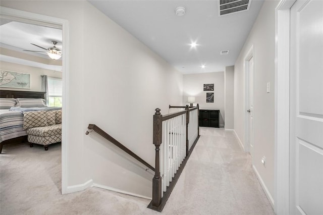 7005 Augusta Ln, Penn Twp Wml, PA 15644 - corridor with an upstairs landing, light carpet, and baseboards