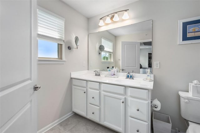 7005 Augusta Ln, Penn Twp Wml, PA 15644 - bathroom with toilet, double vanity, tile patterned floors, and baseboards