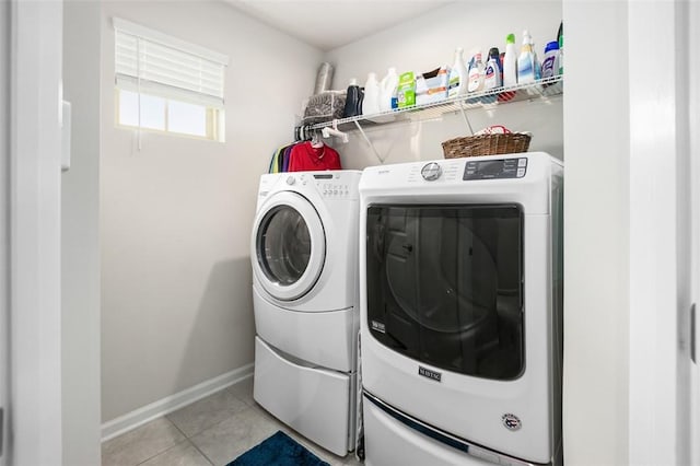 7005 Augusta Ln, Penn Twp Wml, PA 15644 - washroom featuring washer and clothes dryer, light tile patterned flooring, and baseboards