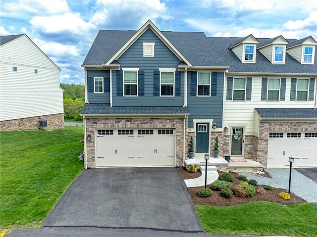 7005 Augusta Ln, Penn Twp Wml, PA 15644 - view of front of home featuring driveway, a garage, a front lawn, stone siding, and a shingled roof