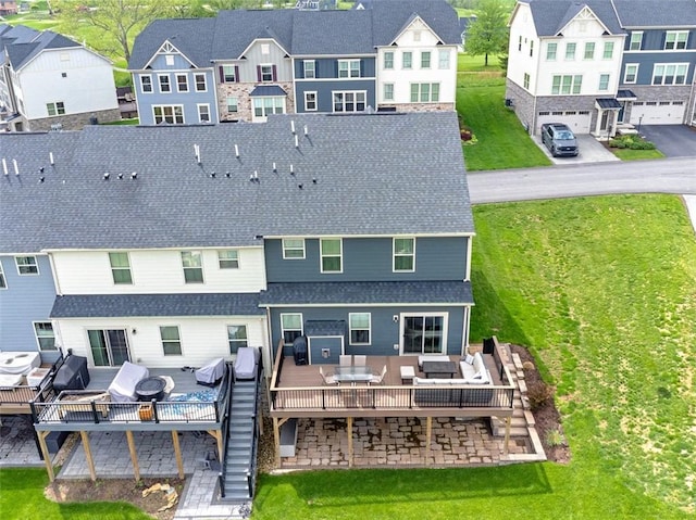 7005 Augusta Ln, Penn Twp Wml, PA 15644 - back of house with an outdoor hangout area, a wooden deck, roof with shingles, a residential view, and a lawn