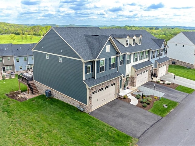 7005 Augusta Ln, Penn Twp Wml, PA 15644 - view of front of home featuring stone siding, an attached garage, driveway, stairs, and a front yard