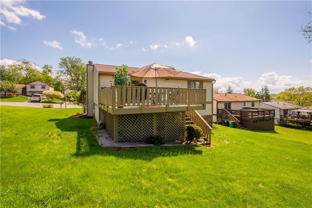 2764 Ravenwood Dr, Bridgeville, PA 15017 - rear view of property featuring a deck, stairs, a lawn, and a chimney
