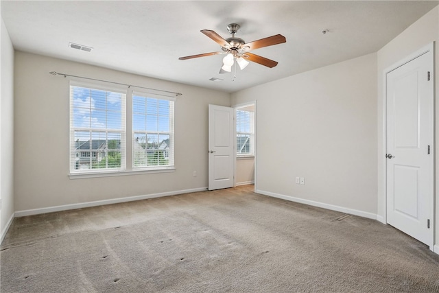 unfurnished bedroom with carpet floors, baseboards, and a ceiling fan