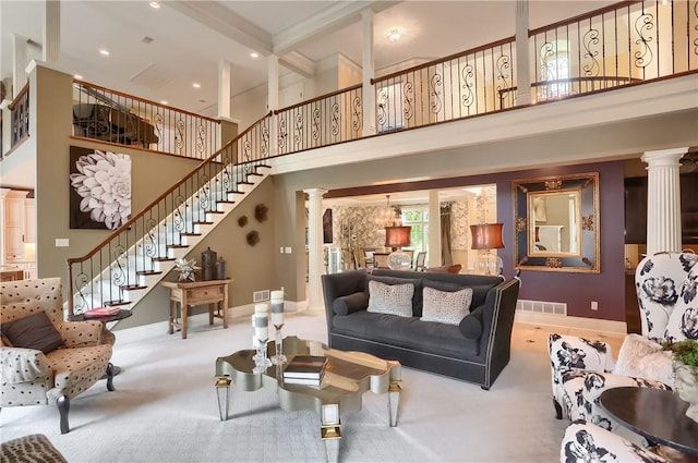 107 Mirage Dr, Cranberry Twp, PA 16066 - carpeted living area with ornate columns, a towering ceiling, stairs, baseboards, and recessed lighting