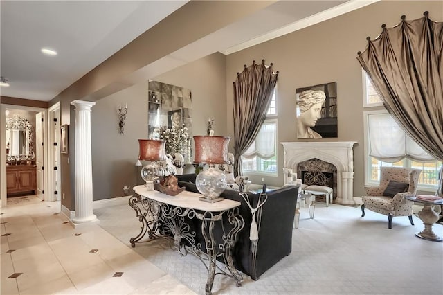 107 Mirage Dr, Cranberry Twp, PA 16066 - sitting room featuring decorative columns, light carpet, a fireplace with raised hearth, and baseboards