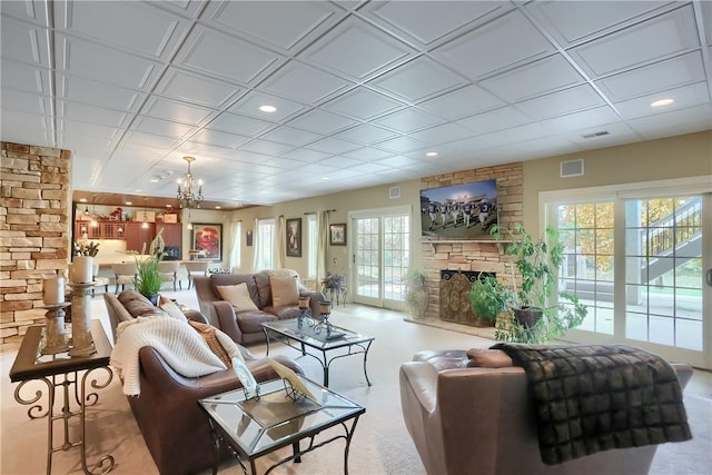 107 Mirage Dr, Cranberry Twp, PA 16066 - living area with healthy amount of natural light, a chandelier, a stone fireplace, and recessed lighting