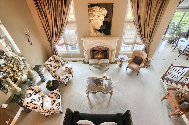 107 Mirage Dr, Cranberry Twp, PA 16066 - sitting room featuring a towering ceiling, a fireplace, baseboards, and carpet flooring