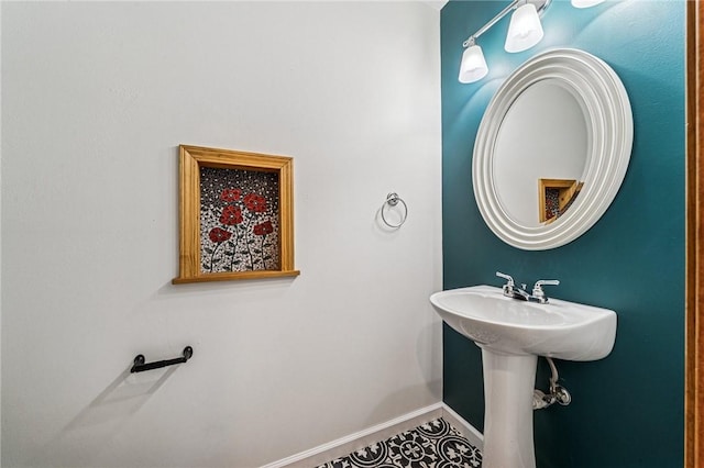 bathroom with baseboards