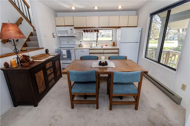 4308 Swiss Mountain Dr, Seven Springs Resort, PA 15622 - dining space featuring a baseboard radiator, light colored carpet, and stairs