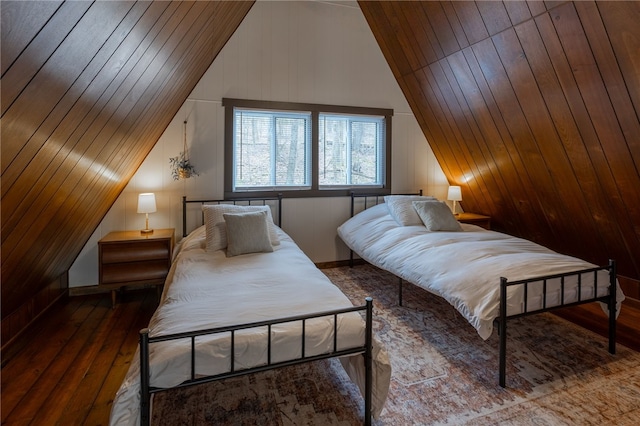 bedroom with vaulted ceiling, hardwood / wood-style flooring, and wooden ceiling