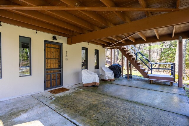 view of patio / terrace featuring stairway and grilling area