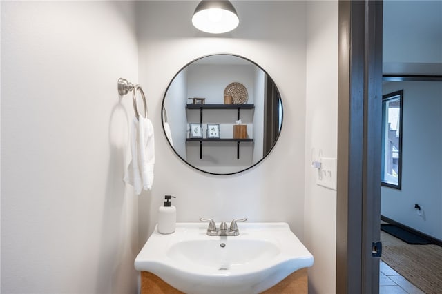 bathroom featuring a sink and tile patterned flooring