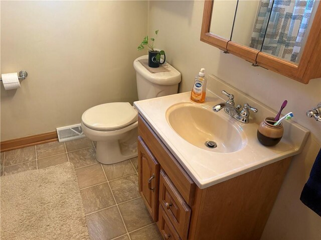 205 S Keel Ridge Rd, Hermitage, PA 16148 - bathroom with toilet, tile patterned floors, vanity, and baseboards