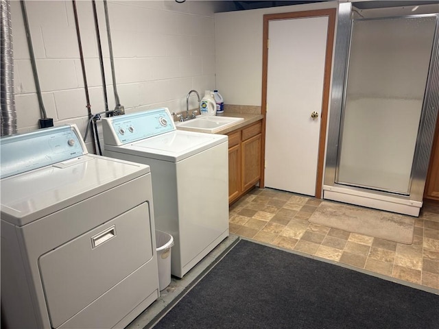 205 S Keel Ridge Rd, Hermitage, PA 16148 - clothes washing area featuring washer and clothes dryer, cabinet space, concrete block wall, and light stone finish floors