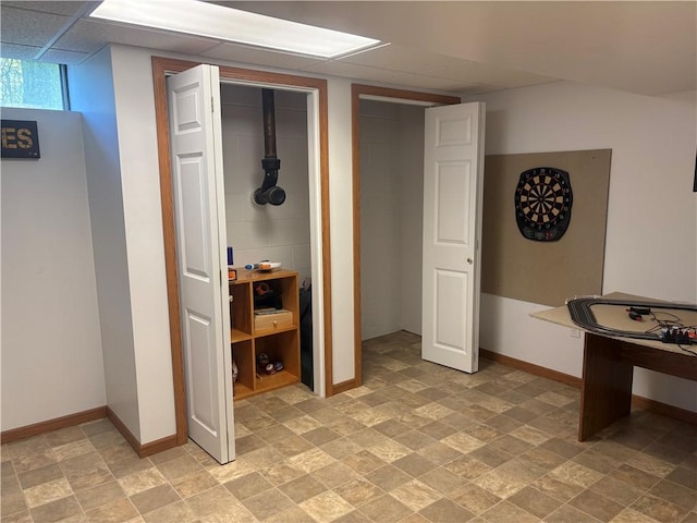 205 S Keel Ridge Rd, Hermitage, PA 16148 - below grade area with baseboards and light stone finish flooring