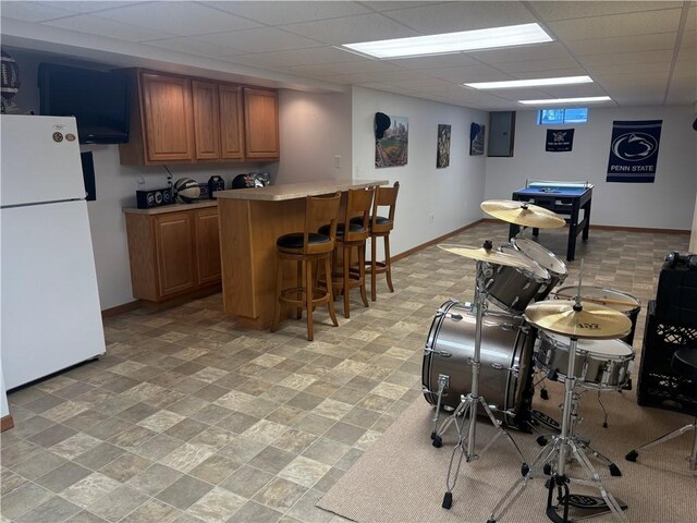 205 S Keel Ridge Rd, Hermitage, PA 16148 - indoor dry bar featuring freestanding refrigerator, baseboards, electric panel, and a paneled ceiling