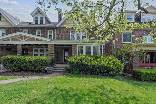 1140 N Negley Ave, Highland Park, PA 15206 - view of front facade featuring a front yard, covered porch, and brick siding