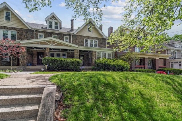 1140 N Negley Ave, Highland Park, PA 15206 - view of front facade featuring a porch, brick siding, a front yard, and a chimney