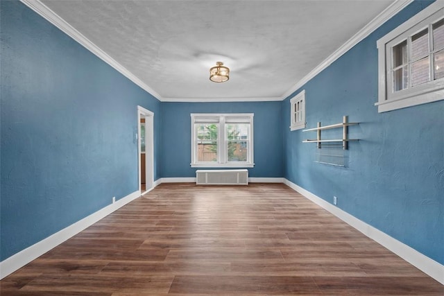 1140 N Negley Ave, Highland Park, PA 15206 - empty room with wood finished floors, crown molding, and baseboards