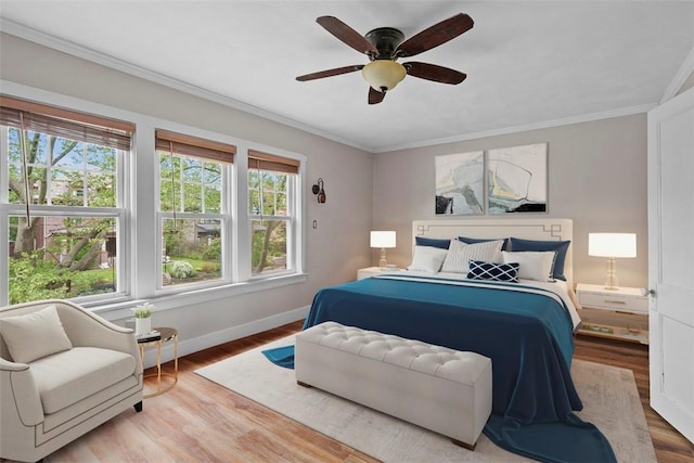1140 N Negley Ave, Highland Park, PA 15206 - bedroom with baseboards, wood finished floors, crown molding, and a ceiling fan