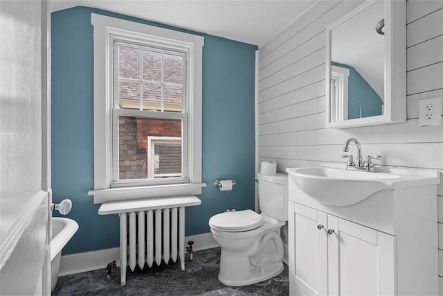 1140 N Negley Ave, Highland Park, PA 15206 - bathroom with radiator heating unit, baseboards, toilet, vanity, and wooden walls