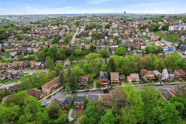 aerial view of property's location with nearby suburban area