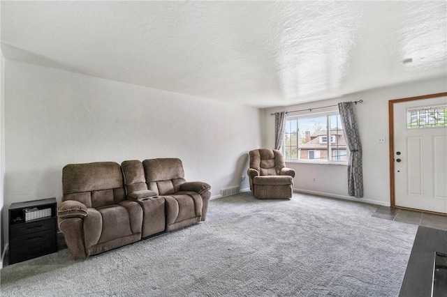 living room featuring carpet floors and baseboards