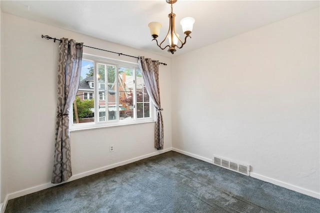 unfurnished room with dark carpet, a chandelier, and baseboards