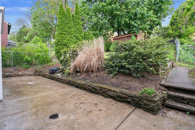 view of yard with fence and a patio area