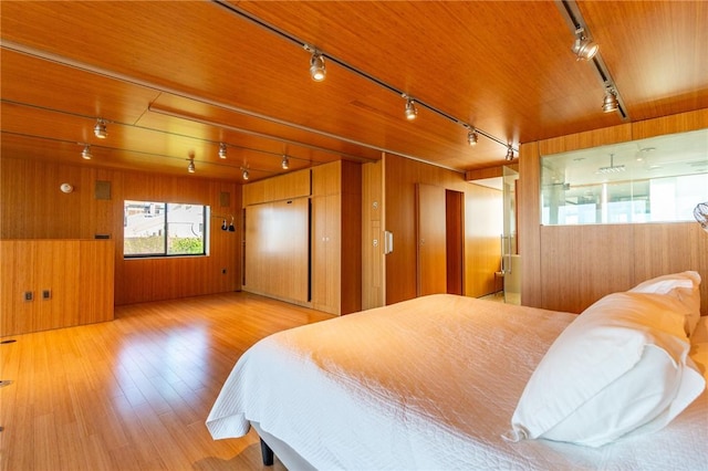 1000 Grandview Ave Unit 1207, Mt Washington, PA 15211 - bedroom featuring track lighting, wooden walls, and wood finished floors