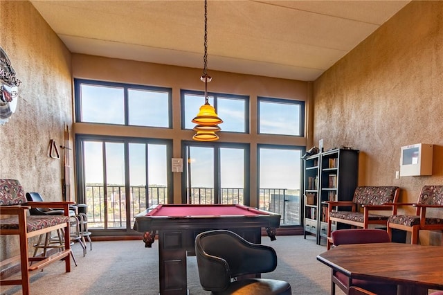 game room featuring carpet flooring, pool table, and a high ceiling