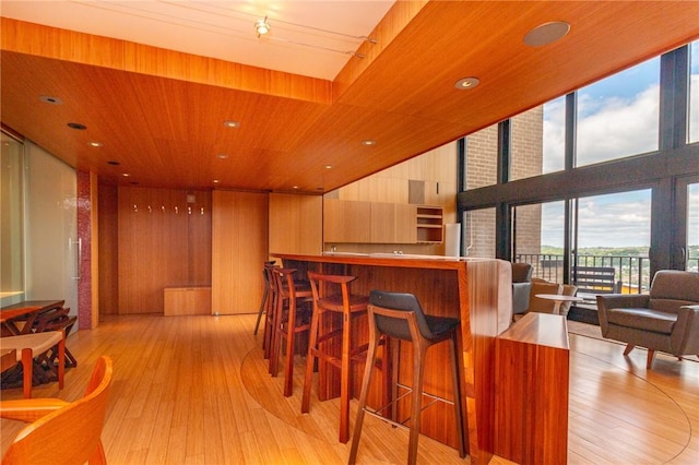1000 Grandview Ave Unit 1207, Mt Washington, PA 15211 - bar area featuring light wood-style flooring, recessed lighting, wood walls, and wood ceiling