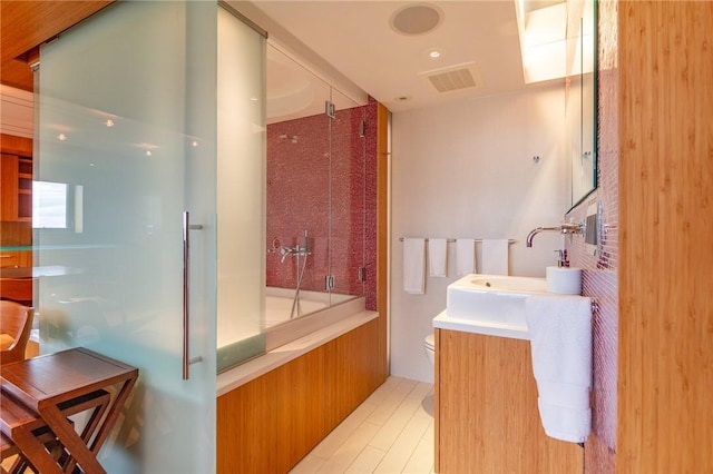 1000 Grandview Ave Unit 1207, Mt Washington, PA 15211 - bathroom featuring toilet, vanity, and combined bath / shower with glass door