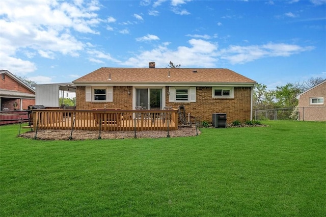 back of house featuring brick siding, a chimney, and central AC unit