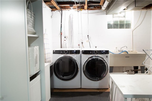 laundry room with washing machine and clothes dryer