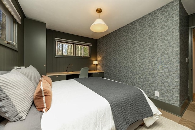 bedroom featuring wallpapered walls
