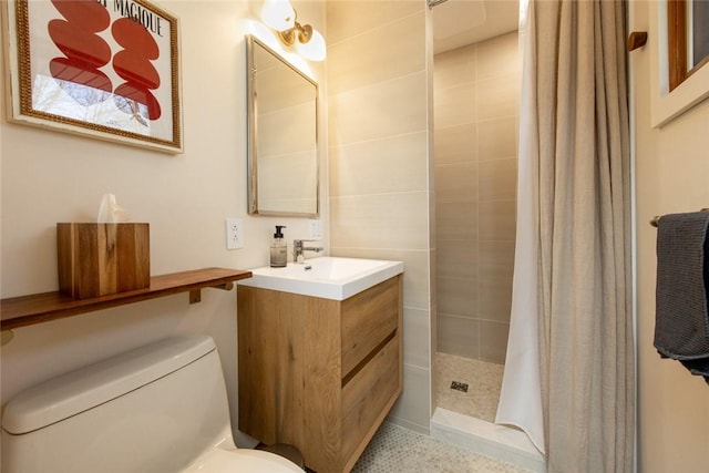 full bath with a stall shower, toilet, and vanity