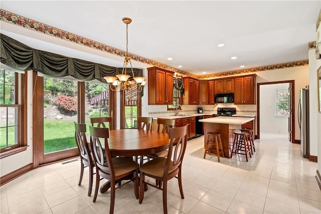 dining space featuring a chandelier, baseboards, light tile patterned flooring, and recessed lighting