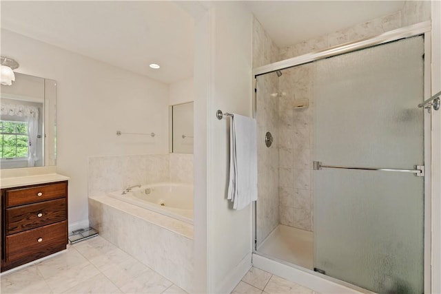 full bath with a shower stall, a whirlpool tub, vanity, marble finish floors, and baseboards