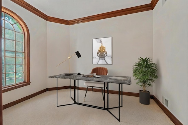 carpeted home office featuring crown molding and baseboards